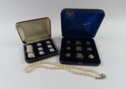 A row of cultured freshwater pearls on a silver cl