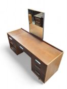 A mid-century-style dressing table with central dr