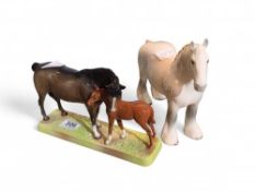 A Beswick figure of a mare and foal upon grass bas