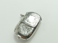 A silver sovereign case, with floral patterns