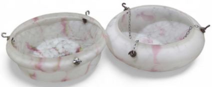 Two round ceiling shades, made up of clouded glass