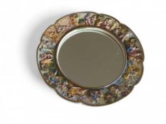 A Capo Dimonte circular wall mirror , 23.5cms diam
