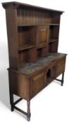 A late-19th-century stained-oak and modified dresser
