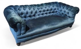 A 20th-century sea-green velvet sofa