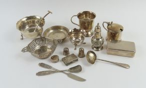 A variety of silver items, including cups, bowls,