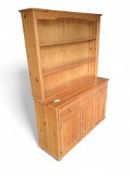A modern and plain stained-pine dresser