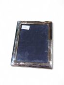 A modern silver photograph frame, of plain form, e
