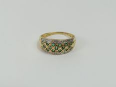 A 14ct gold emerald and diamond dress ring, the em