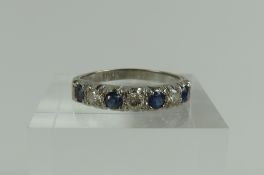 A white gold sapphire and diamond seven stone half