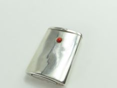 A silver vesta case, smooth with a coral bead at t