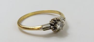 An 18ct gold diamond solitaire ring, with a textur