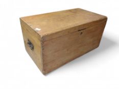 A light pine chest with handles at either side. 39