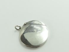A silver vesta case, disk shaped and of smooth for