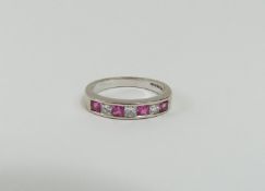 An 18ct white gold pink sapphire and princess cut