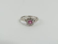 An 18ct white gold pink sapphire and diamond clust