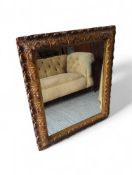 A gilt-framed mirror