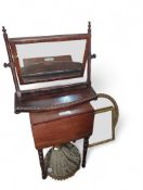 A mahogany drop-leaf table on turned