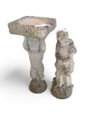 A reconstituted-stone bird bath in the form of a