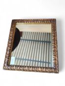 A gilt-framed mirror
