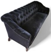 A 20th-century navy-blue velvet sofa