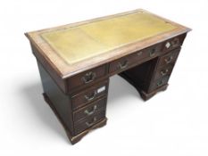 A 20th-century mahogany three-part desk