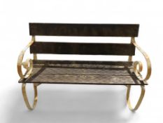 A wooden garden bench with white-painted metal leg
