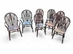 A set of eight oak dining chairs including two car