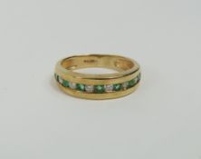 A 9ct gold half eternity ring, the thirteen round