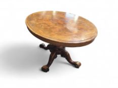 A 19th century walnut veneer table with oval to