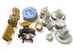A collection of chinaware alongside two figurines