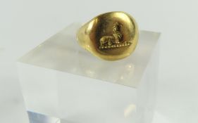 A seal engraved signet ring with worn engraving of