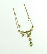 An Edwardian peridot and split pearl necklace, the