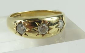 A 9ct gold three stone diamond reproduction gypsy