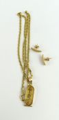 A gold pendant in the form of a cartouche with hie