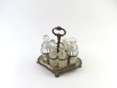 Five cut-glass bottles and holder