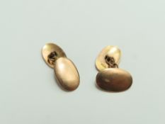 A pair of 9ct rose gold cufflinks, the oval panels