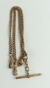 A 9ct rose gold double Albert chain, each curb lin