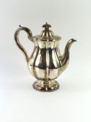 A silver coffee pot