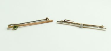A 9ct rose gold bar brooch set with a single round