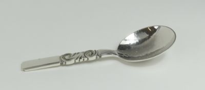 A contemporary silver spoon