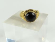 A 19th or early 20th century foil back garnet ring