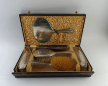A silver dressing table set