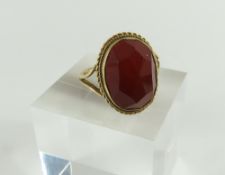 A 9ct gold orange hardstone ring,