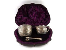 A silver sugar bowl, milk jug and a pair of tongs