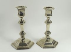 A pair of Edwardian silver candlesticks