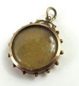 A 19th or early 20th century round photo locket, t