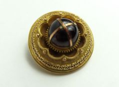 A 19th century brooch set with a large cabochon cu