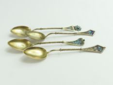 A set of four gilded and enamel coffee spoons