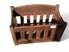 A modern stained wood log basket, 67cm wide, 35cm