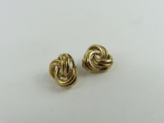 A pair of trefoil shaped gold clip earrings, marke